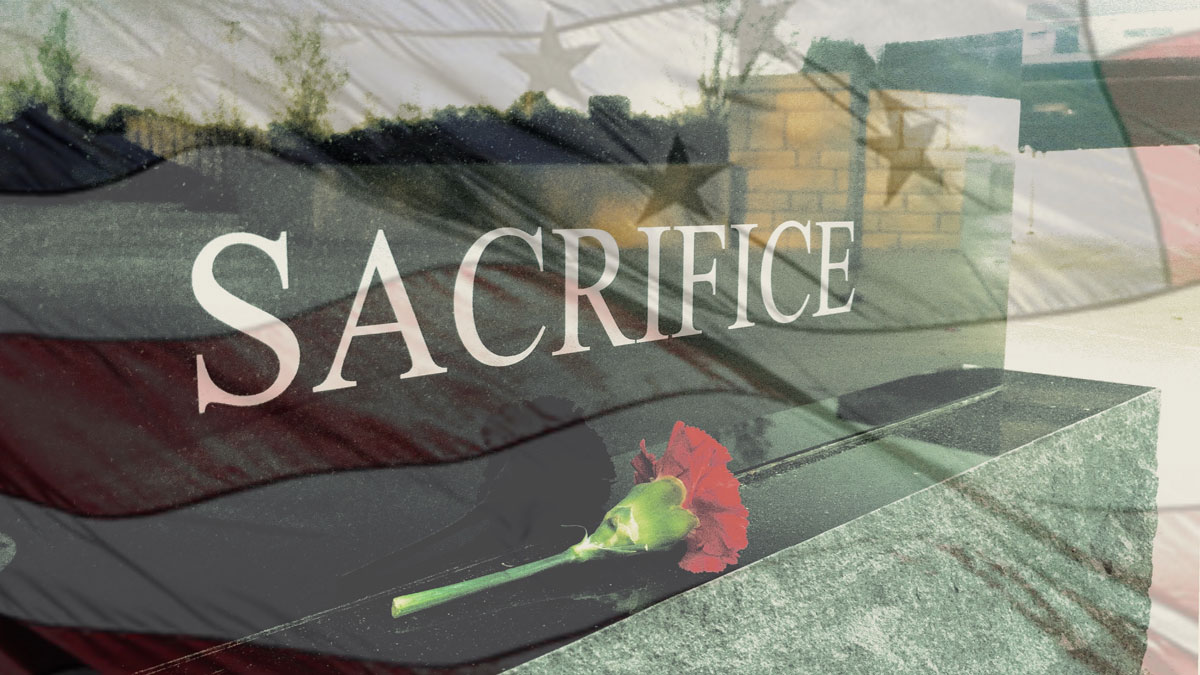 An image of a monument that says 'sacrifice'