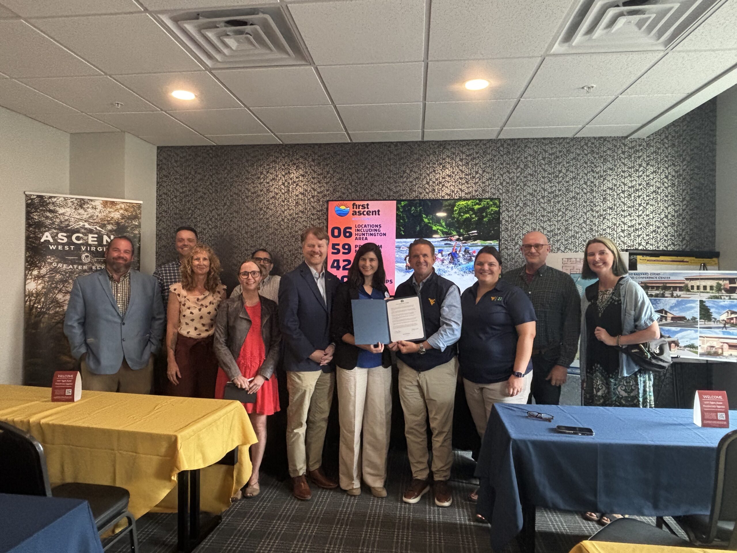 An image of a local group of people in Elkins, WV, welcoming the new president of WVU.