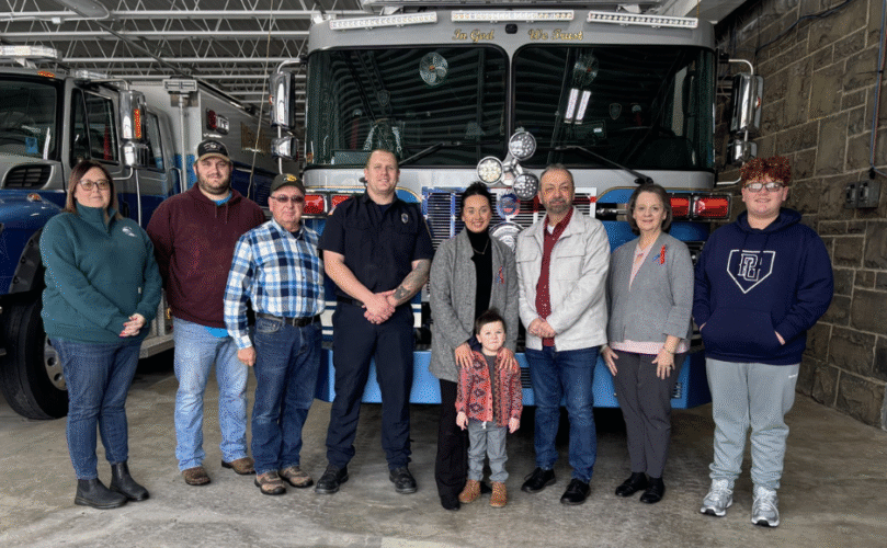 An image of a family in front of a firetruck for CHD Awareness Week, Feb. 2026, Elkins, WV.