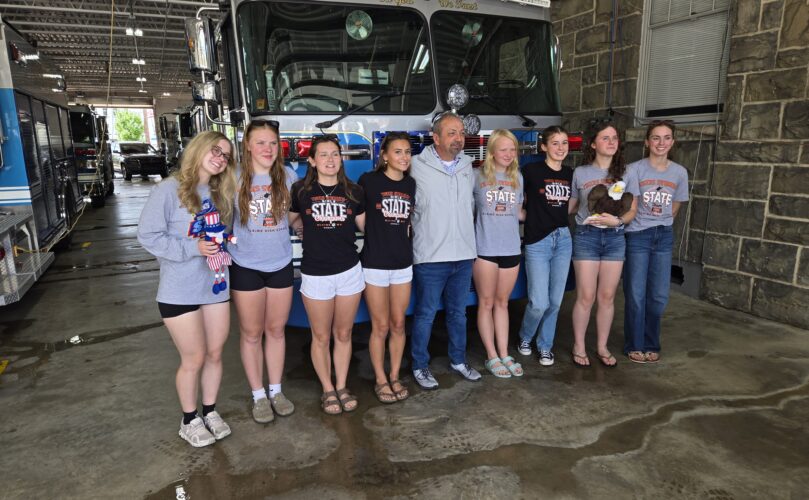 Elkins HS girls swim team with Jerry Marco, Mayor of Elkins, June 17, 2026.